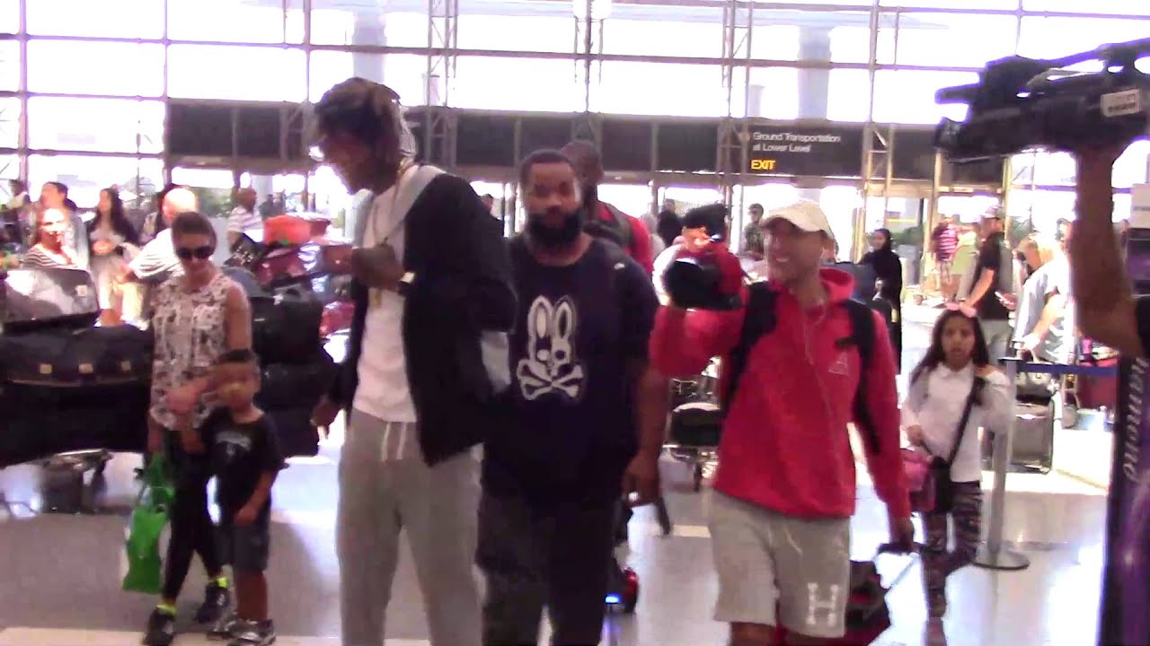Wiz Khalifa departing at LAX Airport riding a Gold WI Board