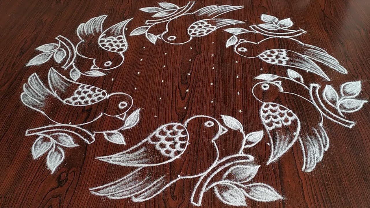 Sankarthi chukkala muggulu (11×6) dot's.. beautiful Bird's rangoli