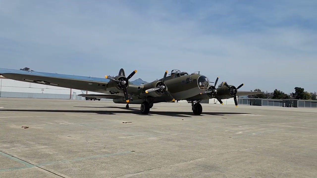 B-17 Flying Fortress engine startup and take-off followed by three P-51 Mustangs.
