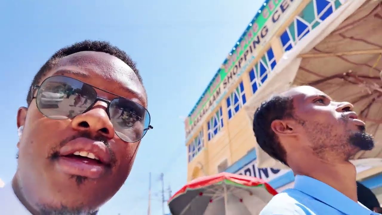 HE SHOWED ME MOUNTAINS THAT ARE SHAPED LIKE B&&BS (SOMALILAND HARGEISA)
