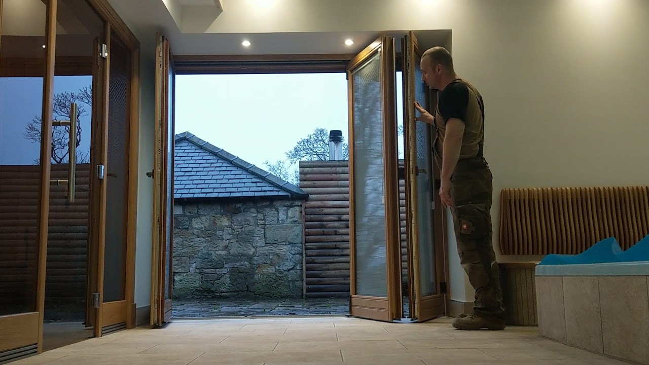 Roto hardware folding door, triple glazing, solid oak