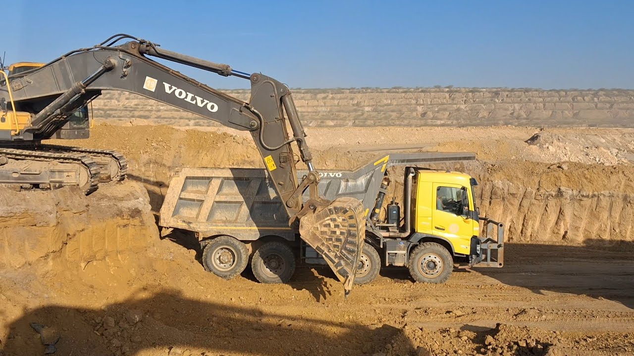 loading skid steer in dump trailerhow to load a dump truck with a loaderbackhoe loader working video