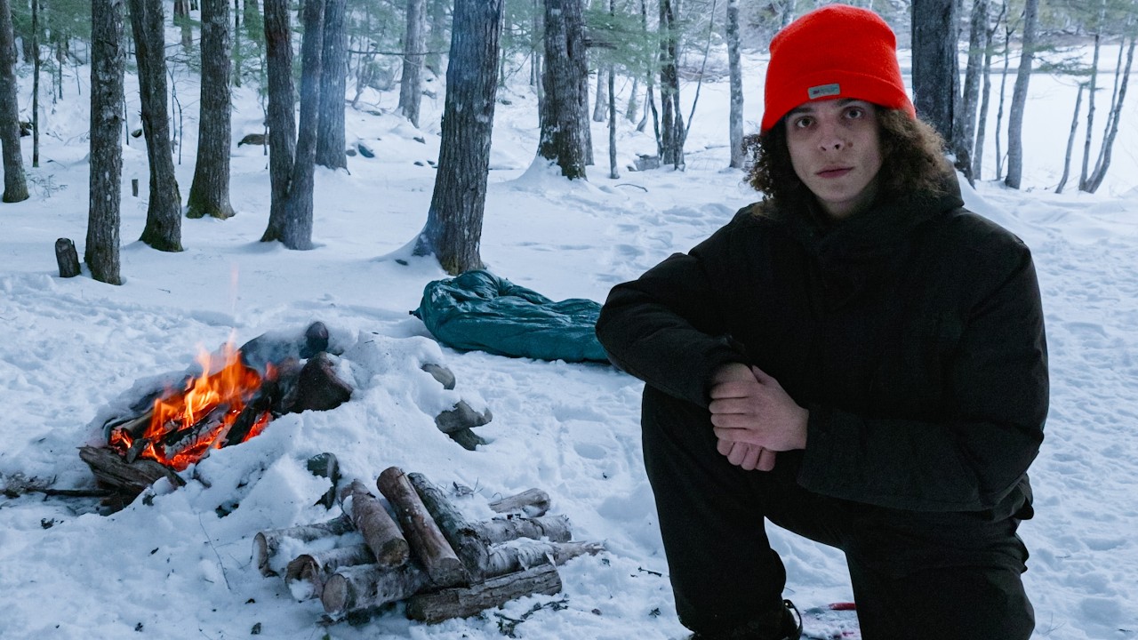 Camping Alone by a Frozen River