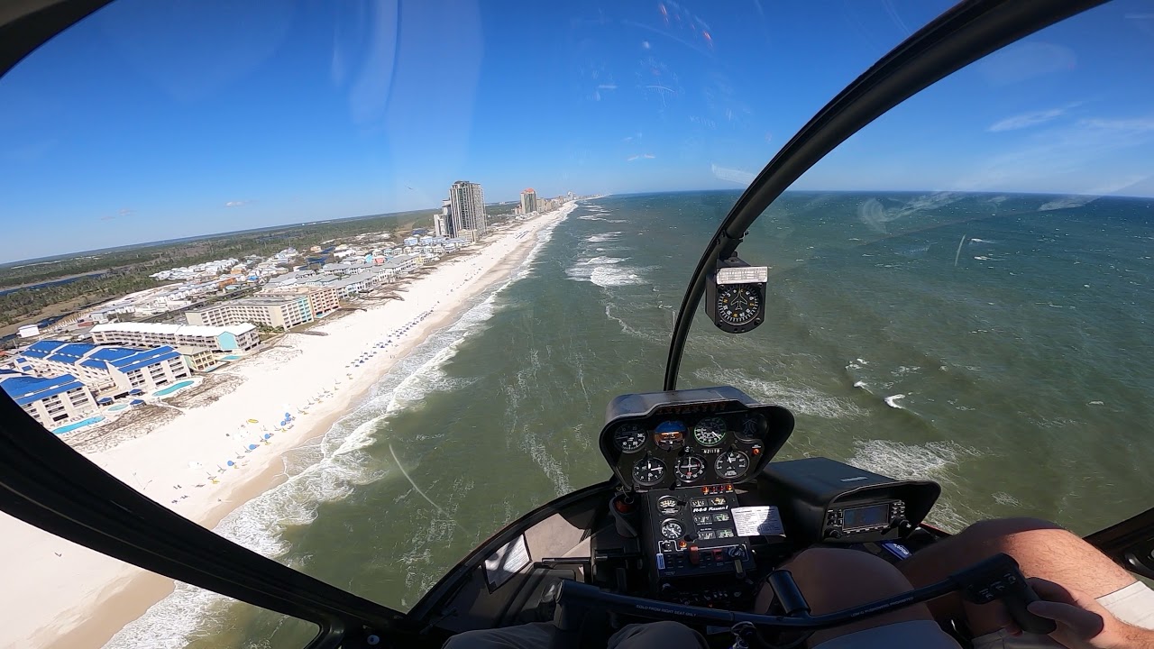 Flying from Gulf Shores eastbound to Orange Beach in a Helicopter along the Beach
