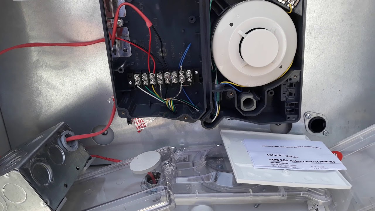 Installing addressable duct detector on hotel roof. Additionally addressable relay.