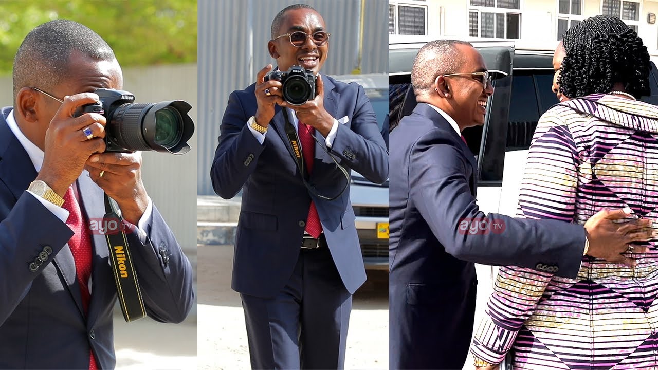WAZIRI JERRY SILAA ALIVYOMPIGA PICHA ALIYEKUWA WAZIRI WA ARDHI MABULA NA KUMFUNGULIA MLANGO WA GARI