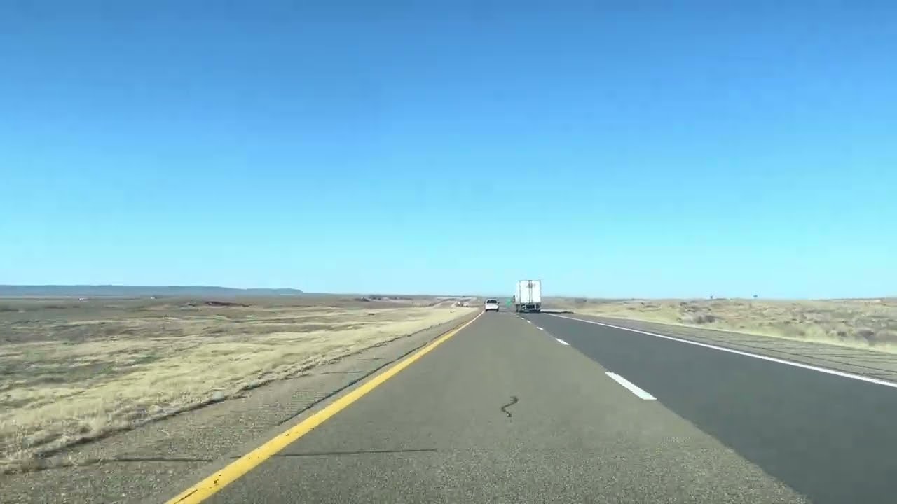 Drive through endless grasslands in New Mexico, USA