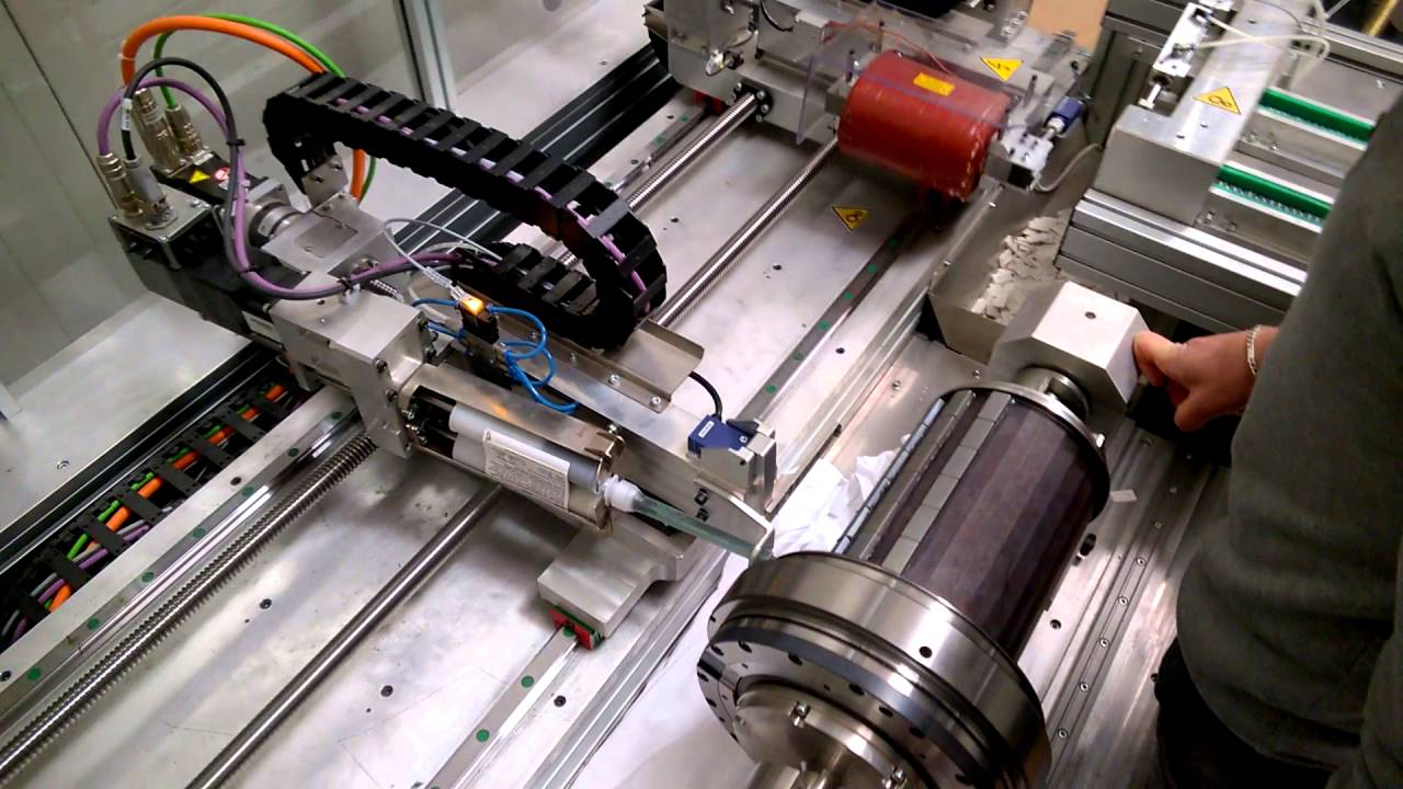 EXCOGITA 2013 - macchina montaggio automatico magneti