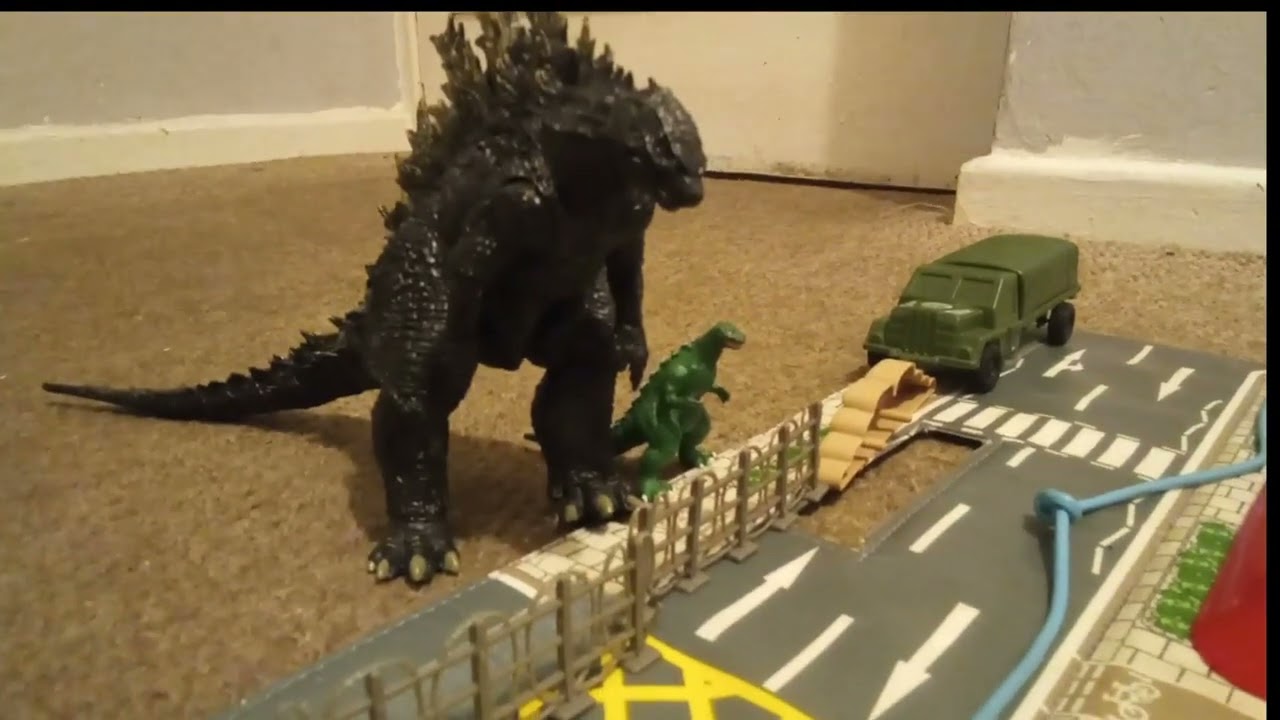 Godzilla JR falls over and blows up.