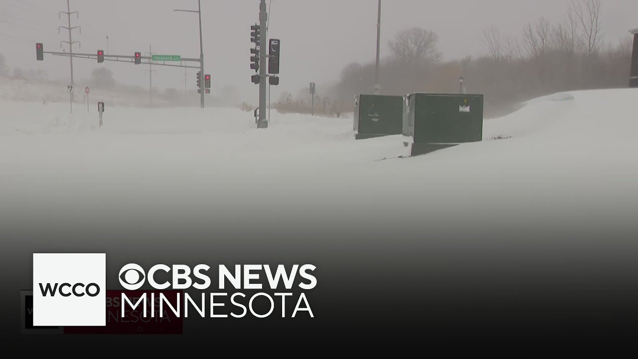 Snow builds looming snow drifts and completely covered roads in south Twin Cities