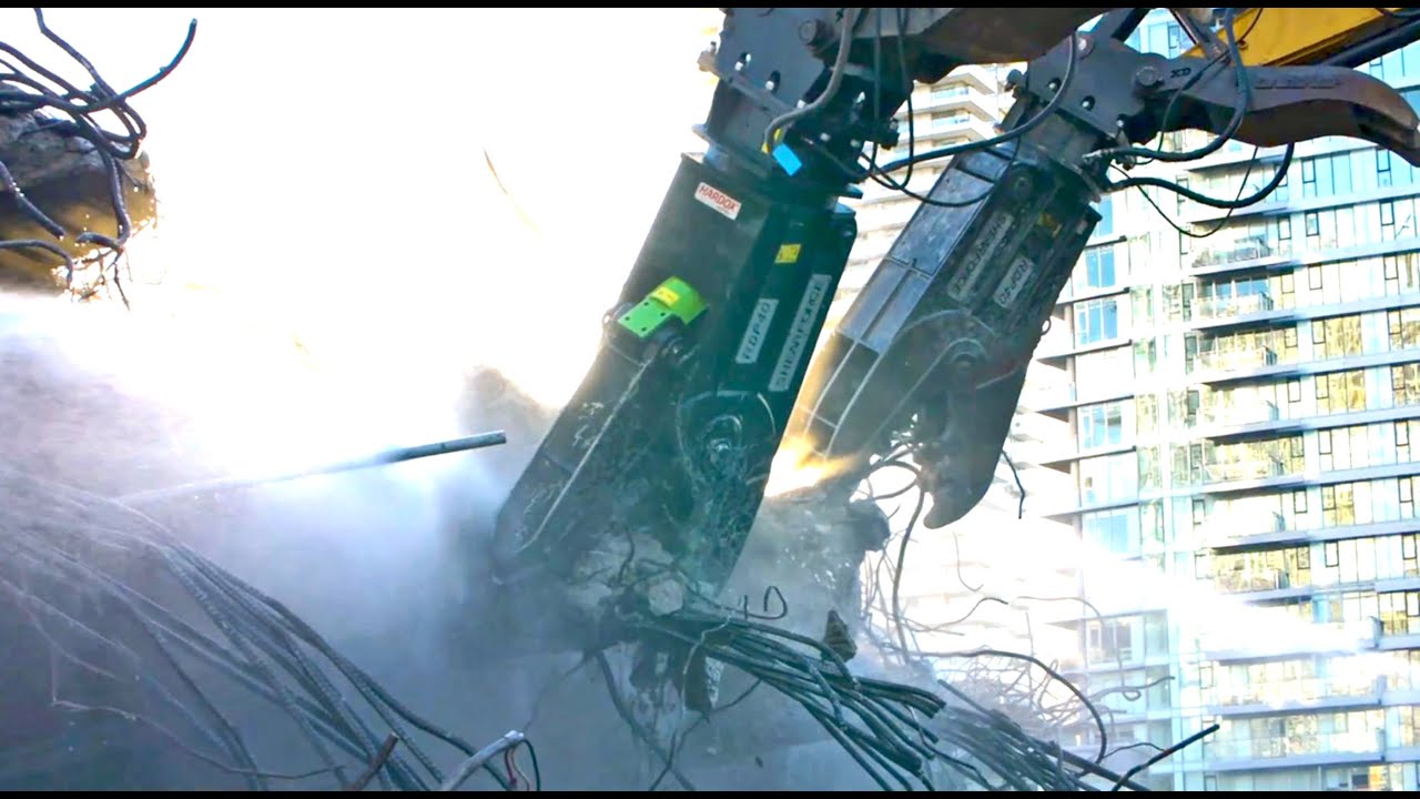 Two italmek rotating pulverizers IF40 demolishing Grandville Street Bridge in Vancouver Canada