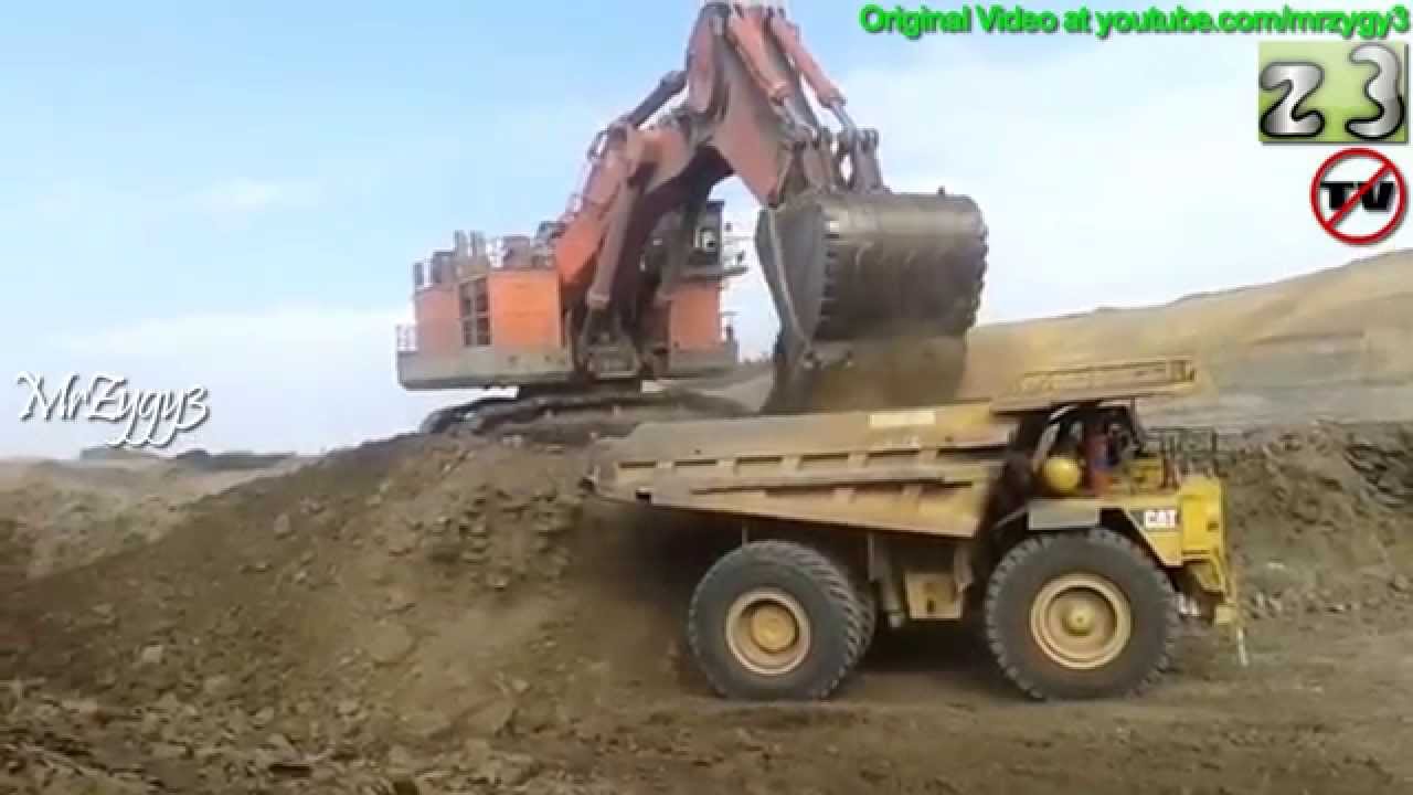 Hitachi EX5500 Excavator Loading CAT 789 Dump Truck Open Pit Mining
