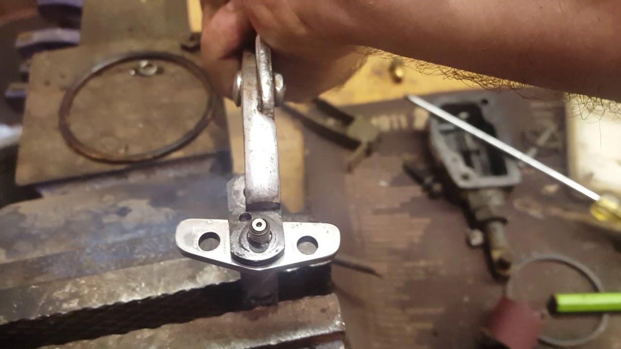 Disassembly, cleaning, and reassembly of the American Bosch injector pump fuel control lever.