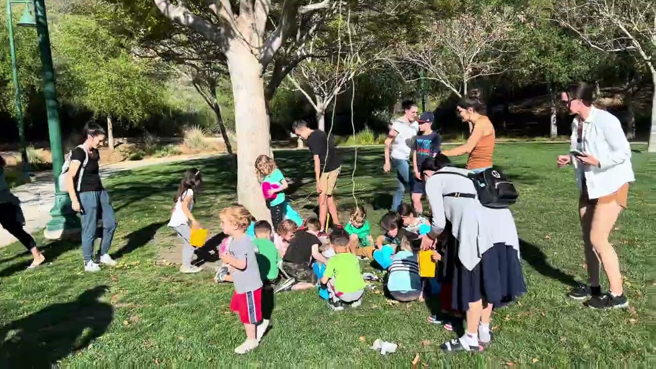 Kids fun game at the park with their classmates. 