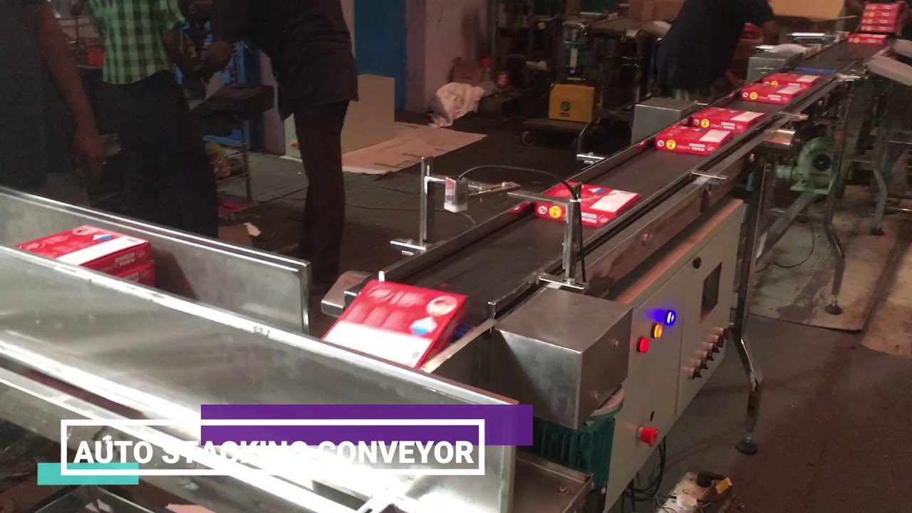 Automatic stacking conveyor system - MGEE Industries