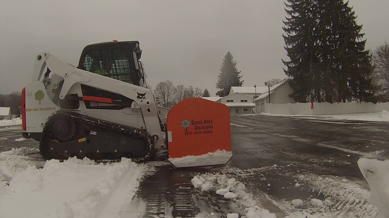 Bobcat t650 pushing snow with 8ft snow pusher