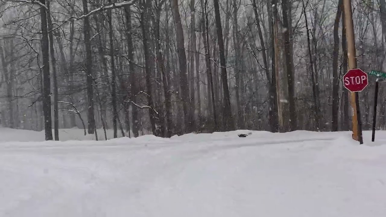 going for a ride on my new 4 wheeler in th snow we got 18 inches of snow so far in central pa