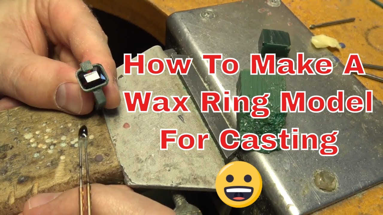 Wax carving a ring for a garnet setting.