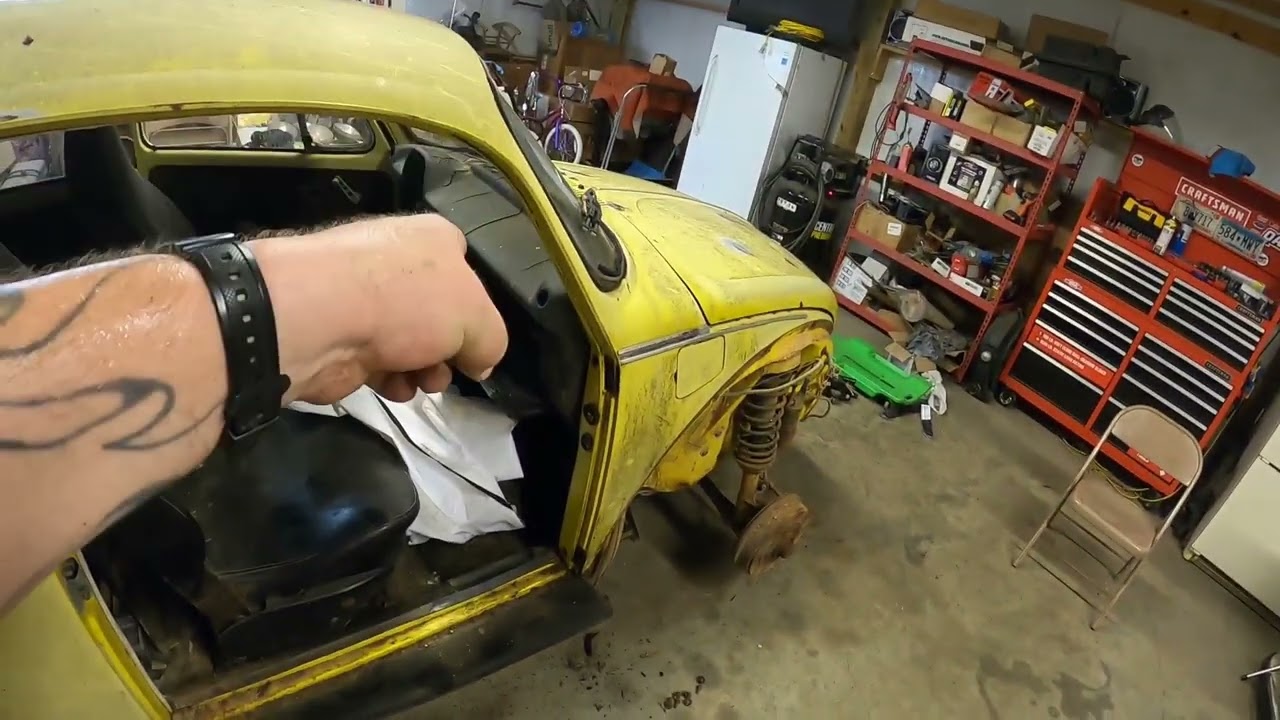 The Rust Bug disassembly continues.  How to remove a 74 VW Super Beetle doors.