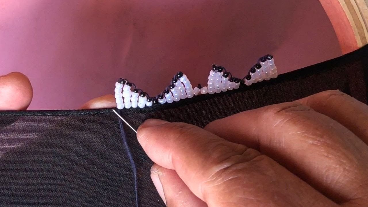 Making the boarder with black and white beads on a dress in an easy way 