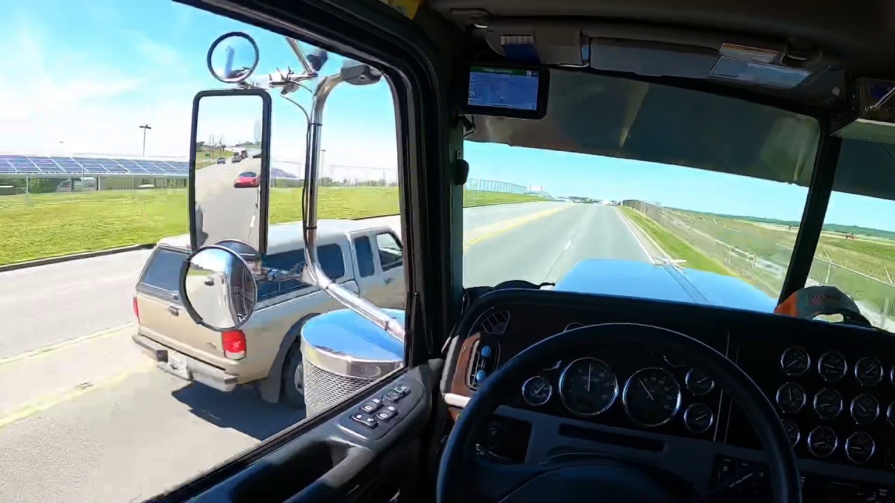 Peterbilt 389 glider hauling a Deere 850K dozer