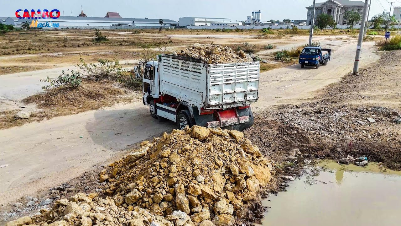Nicely Start Project Landfill by Expertly  Skill Dozer D37P Pushes Rocksoil &5TTrucks unloading soil