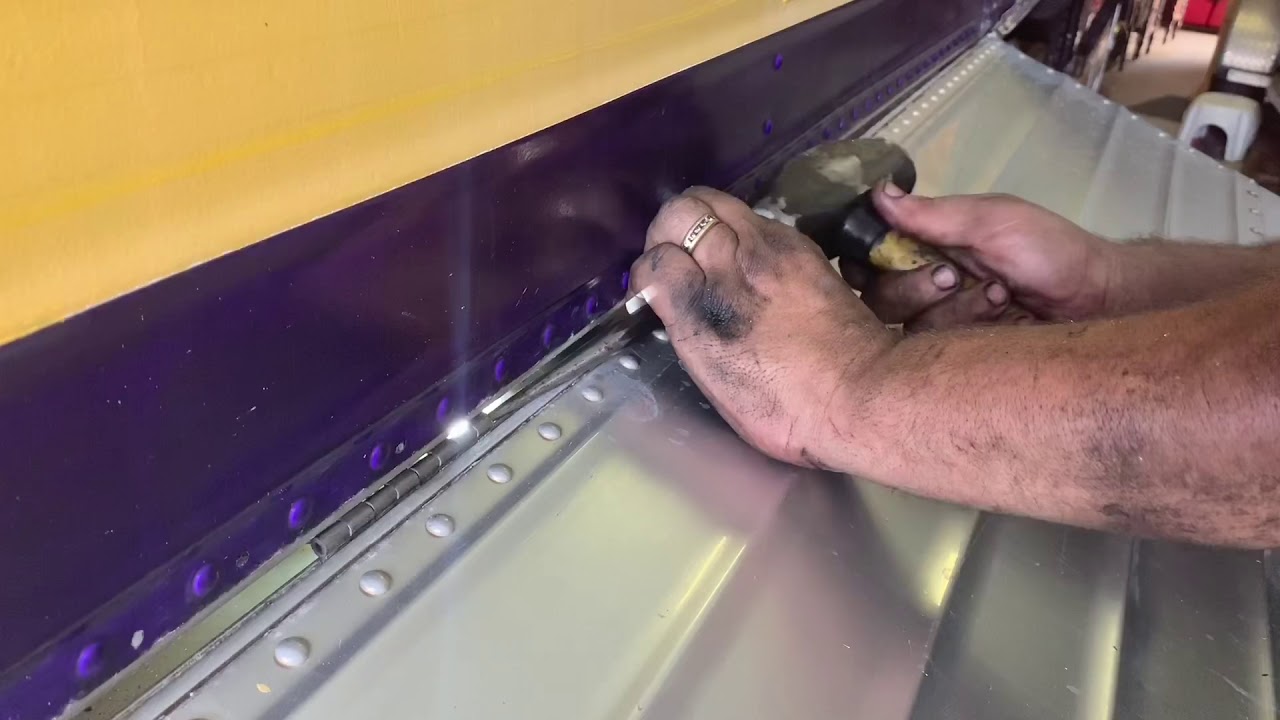 Replacing bus bay door rubber hinge with stainless steel