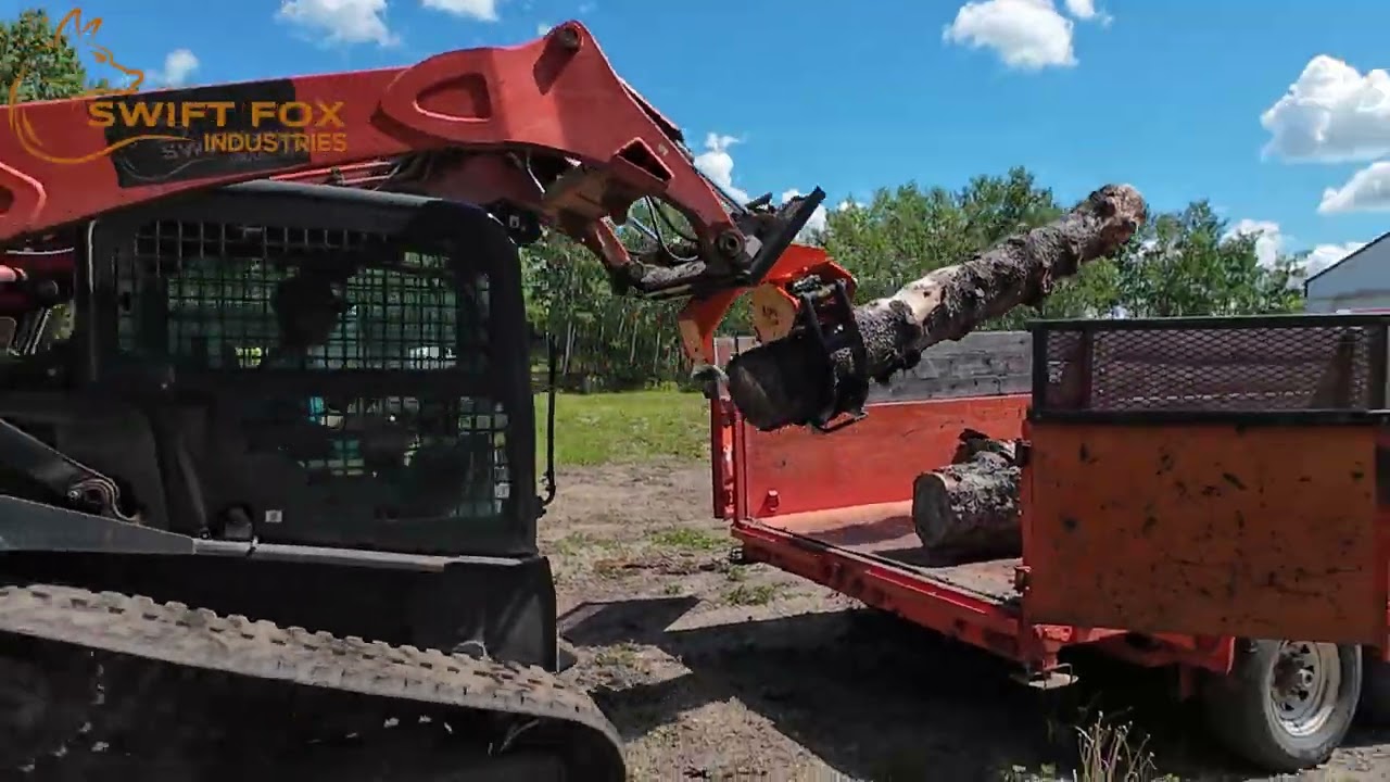 Rotating Log Grapple Moving and Loading Logs