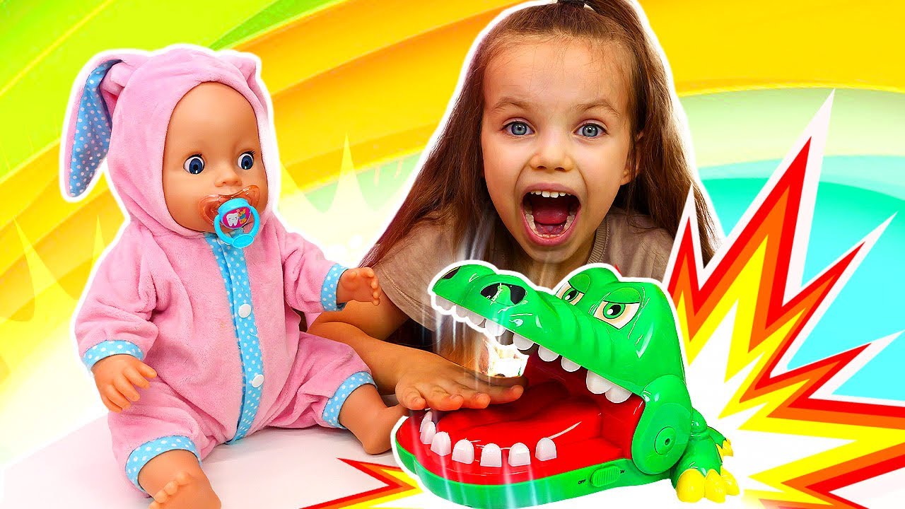 Maya teaches the doll to brush her teeth and explains why it is so important.