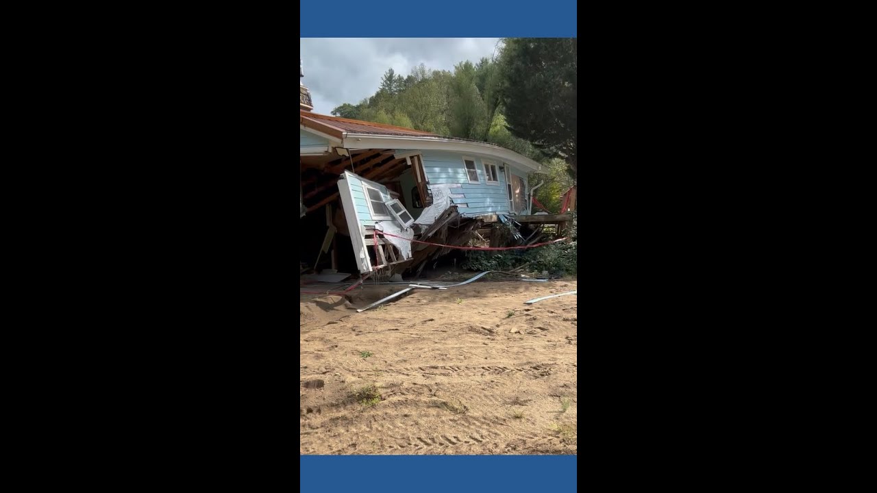 House torn apart by Helene still sitting on riverbank in Yancey County