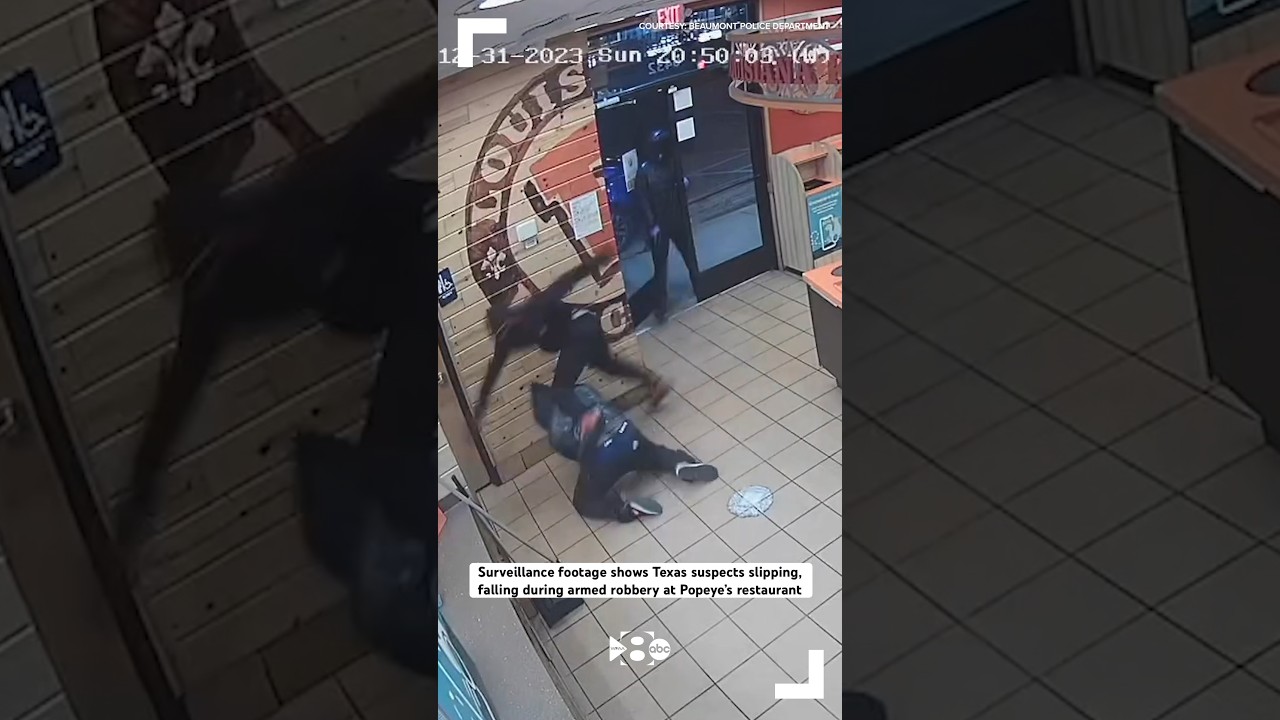 Surveillance footage shows Texas suspects falling during armed robbery at Popeye&rsquo;s restaurant