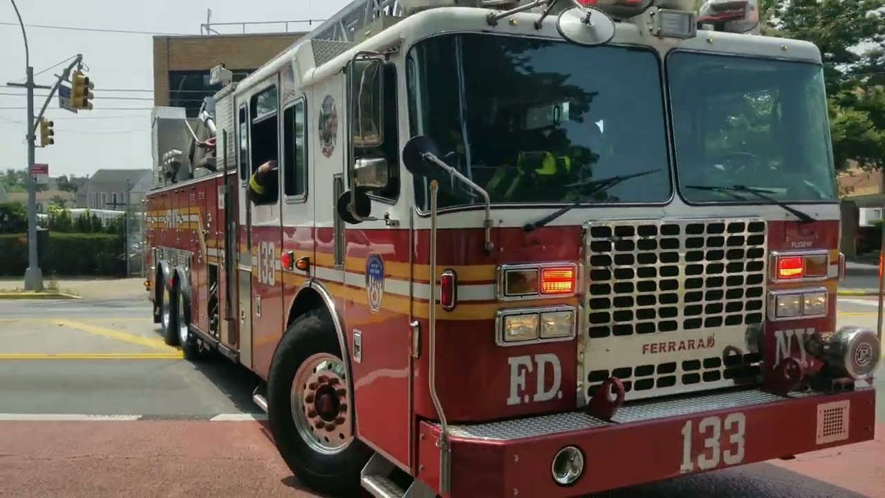 FDNY Engine 275 and Ladder 133 responding to a fire in a building.
