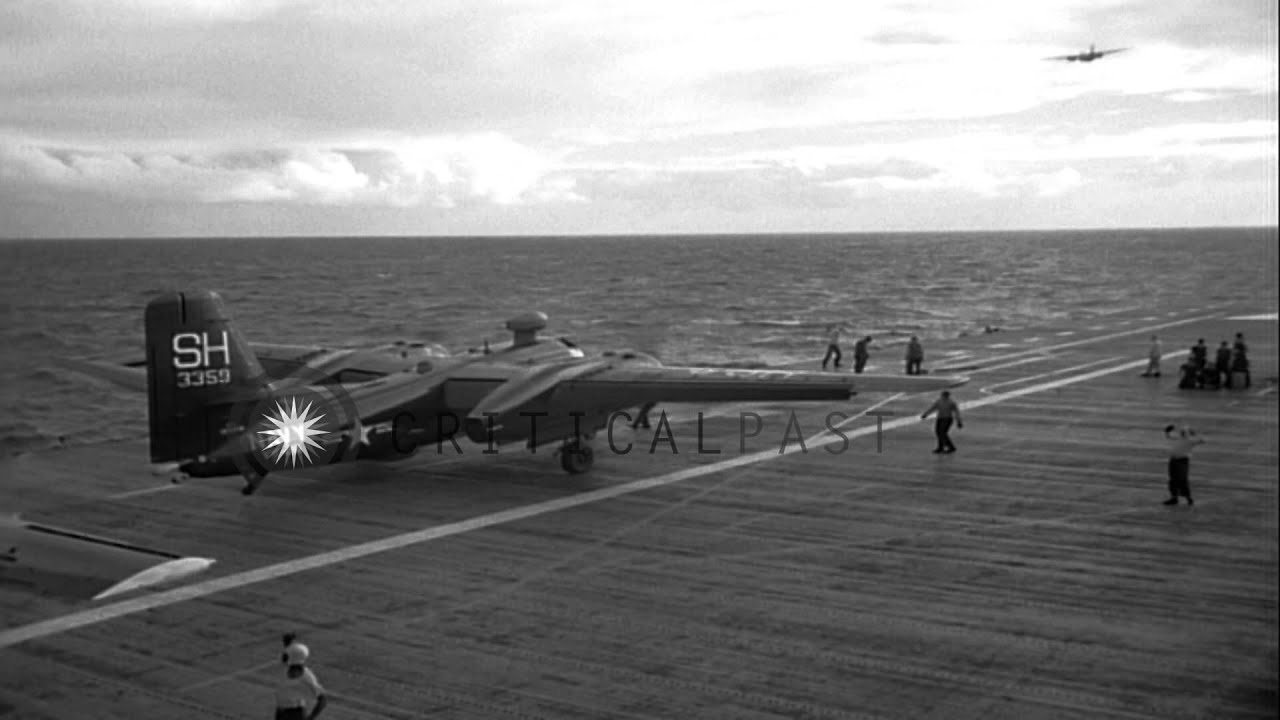 Pilots come up on the deck and US Grumman S2F trackers aircraft take off from USS...HD Stock Footage