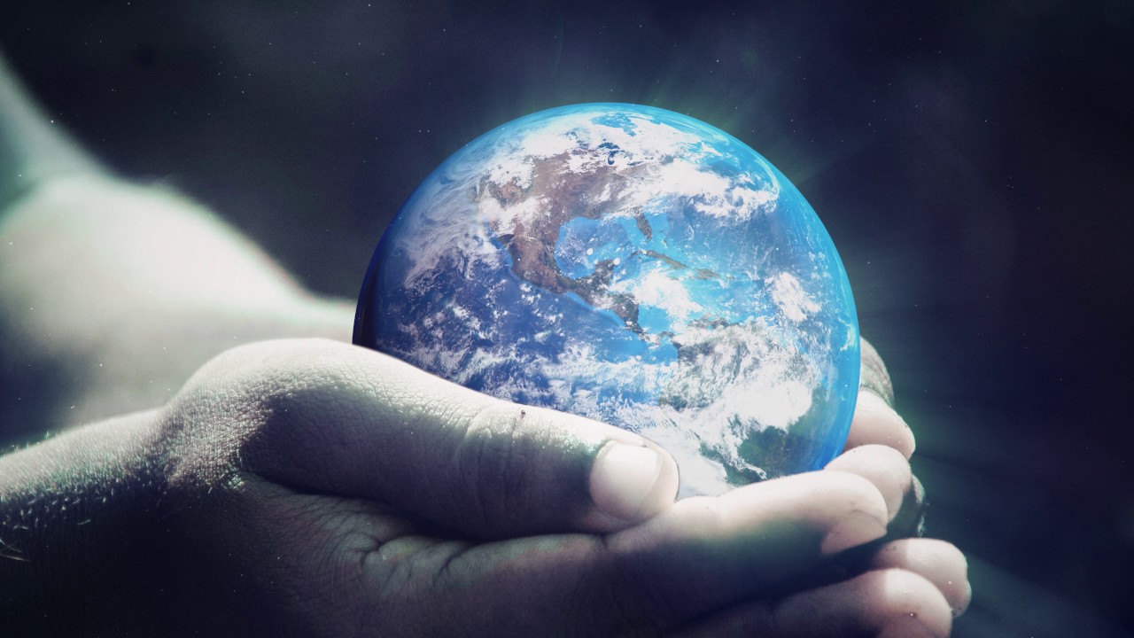 4K Motion Background - Earth spinning in a boys hands