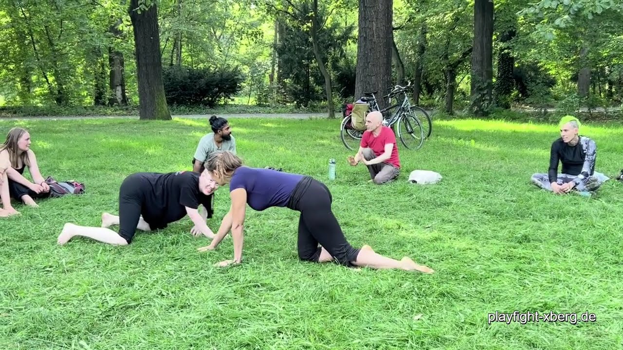 girls wanna and having just fun playfighting at summer p.f. party in the park