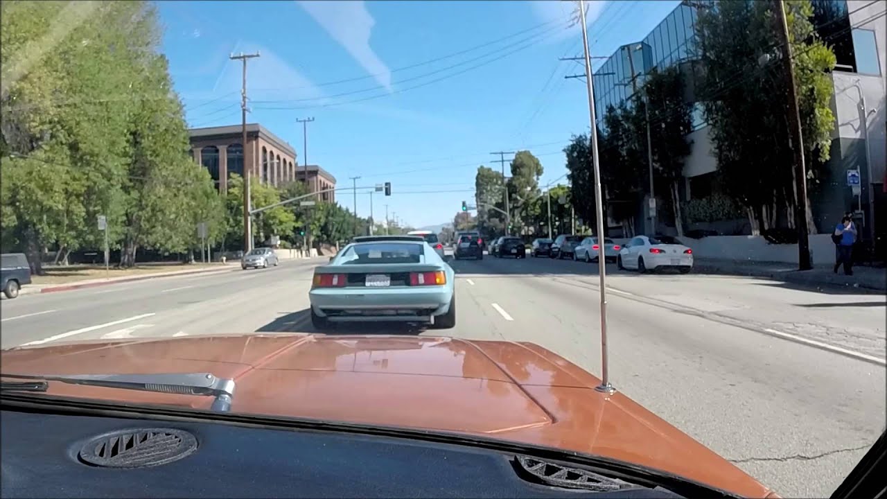 1973 Jensen Interceptor driving over the Sepulveda Pass.