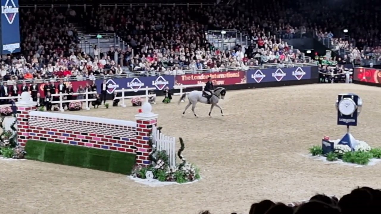 Guy Williams 2.15m puissance jump on Mr Blue Sky UK at 2022 London International Horse Show