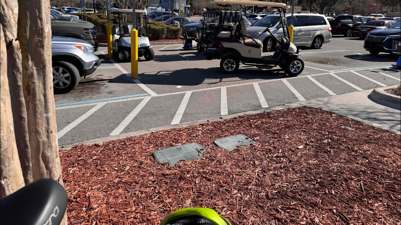 75° 2/10/26 Florida - Shopping by BIKE - Checking out 3 GOLF CARTS near by. 