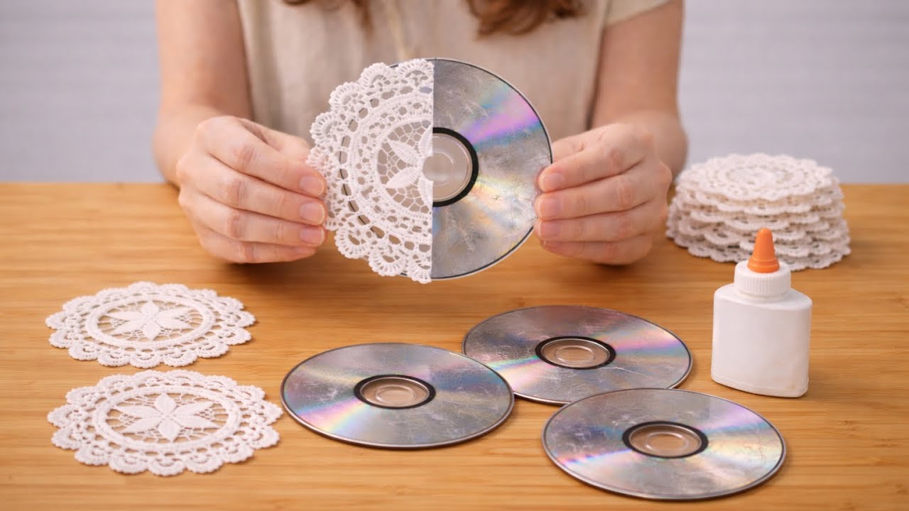 I glued old lace from my dowry onto damaged CDs! Incredible recycling!