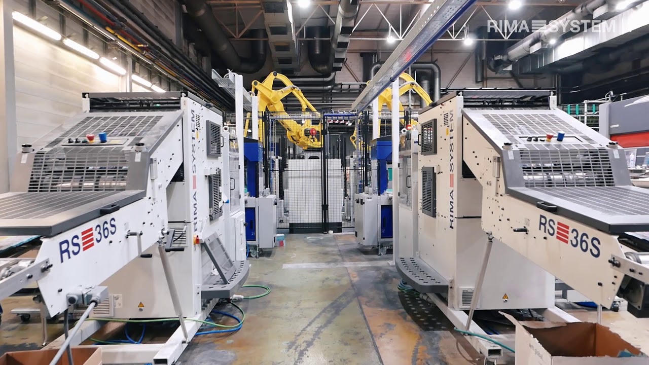 Palletizing Robots, Lift Stackers and Rotary Trimmers behind 96pp manrolandgoss press