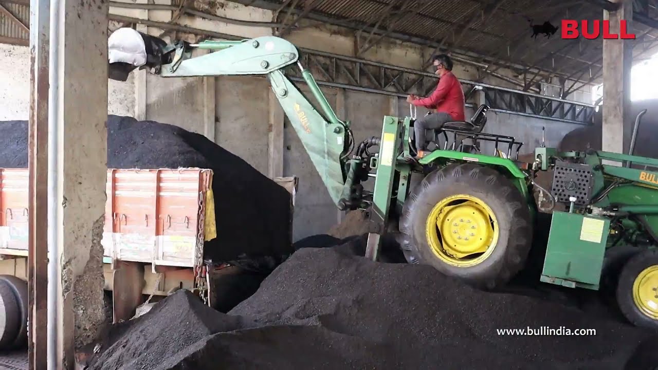 BULL V2 Backhoe Loader for coal unloading application .