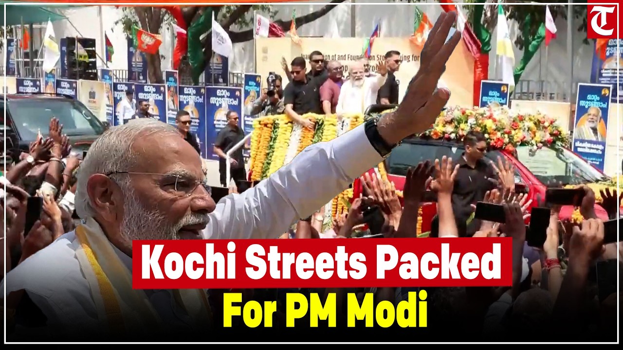 PM Modi greets massive crowd during grand roadshow as streets in Kochi overflow with supporters.