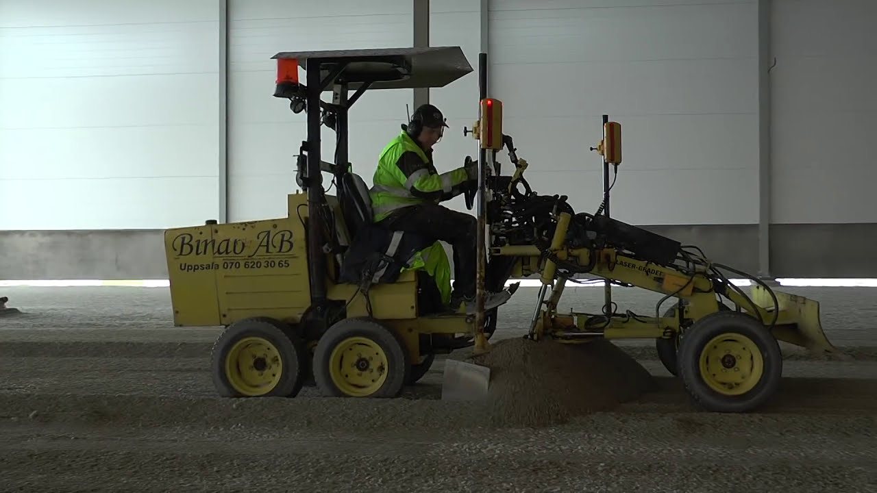 Volvo EW160D excavator, and Mini Laser grader at a new building in Visby feb 2017