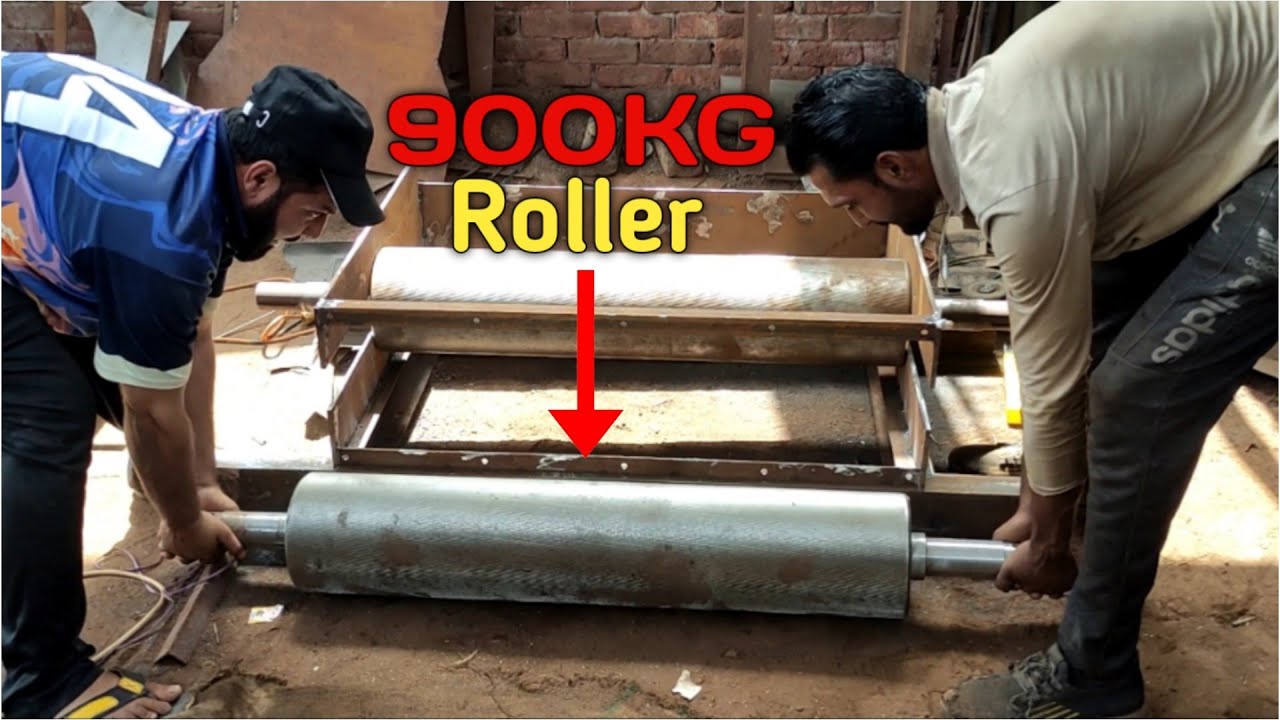 How Two men lift a 900kg roller into a crumbler machine