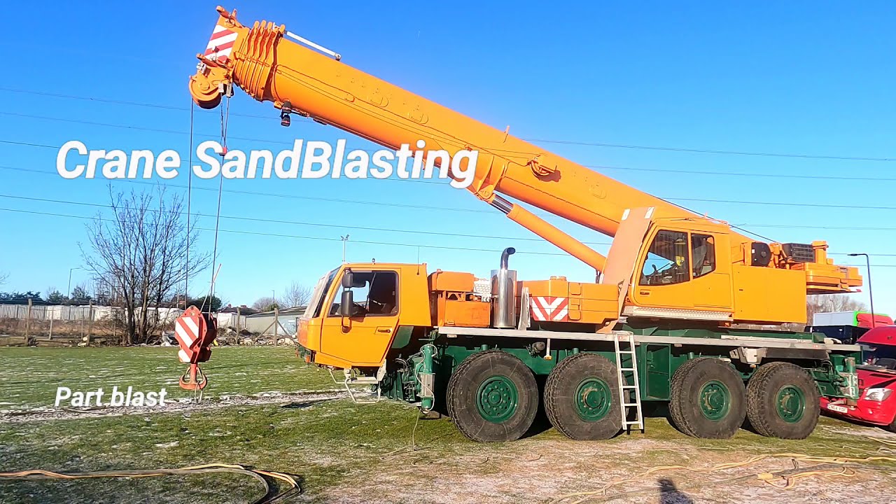Sandblasting a Crane surface preparation for paint