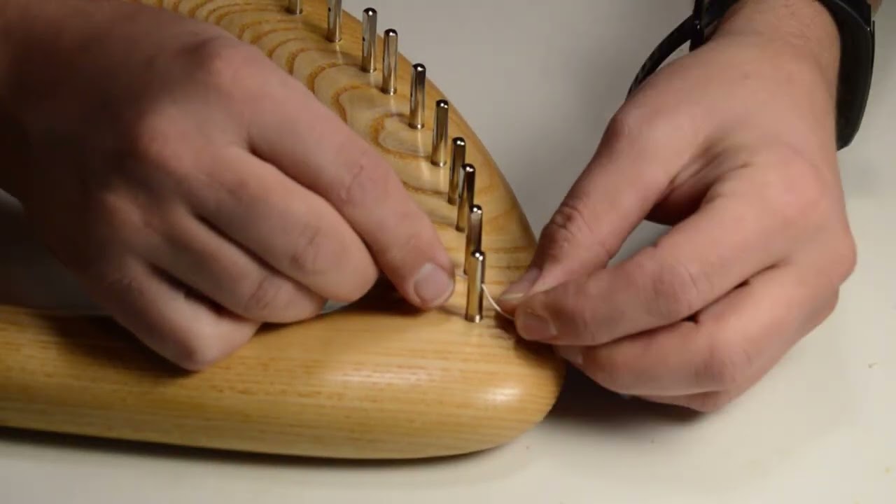 Changing a string on a lyre