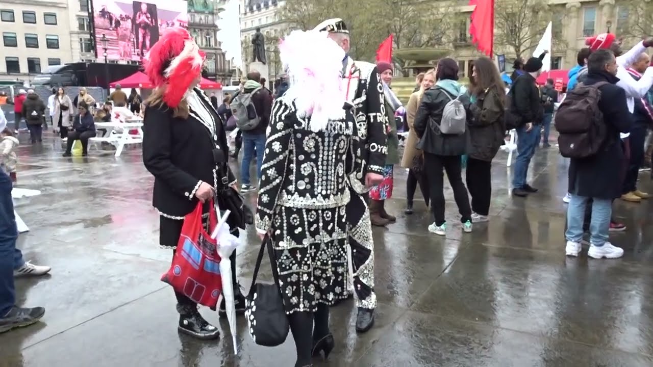 Pearly Kings and Queens smile for the camera at St Georges Day 2023 celebrations in Trafalgar Square