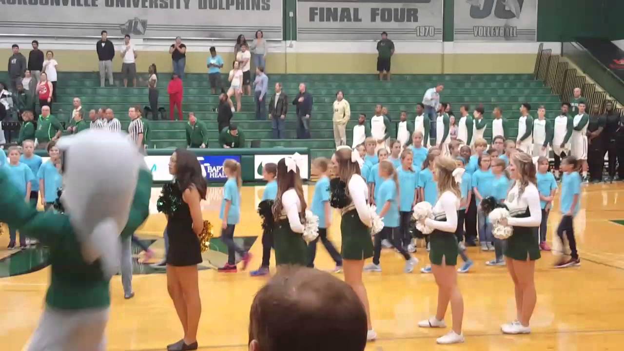 Addie singing the National Anthem with Singing Otters