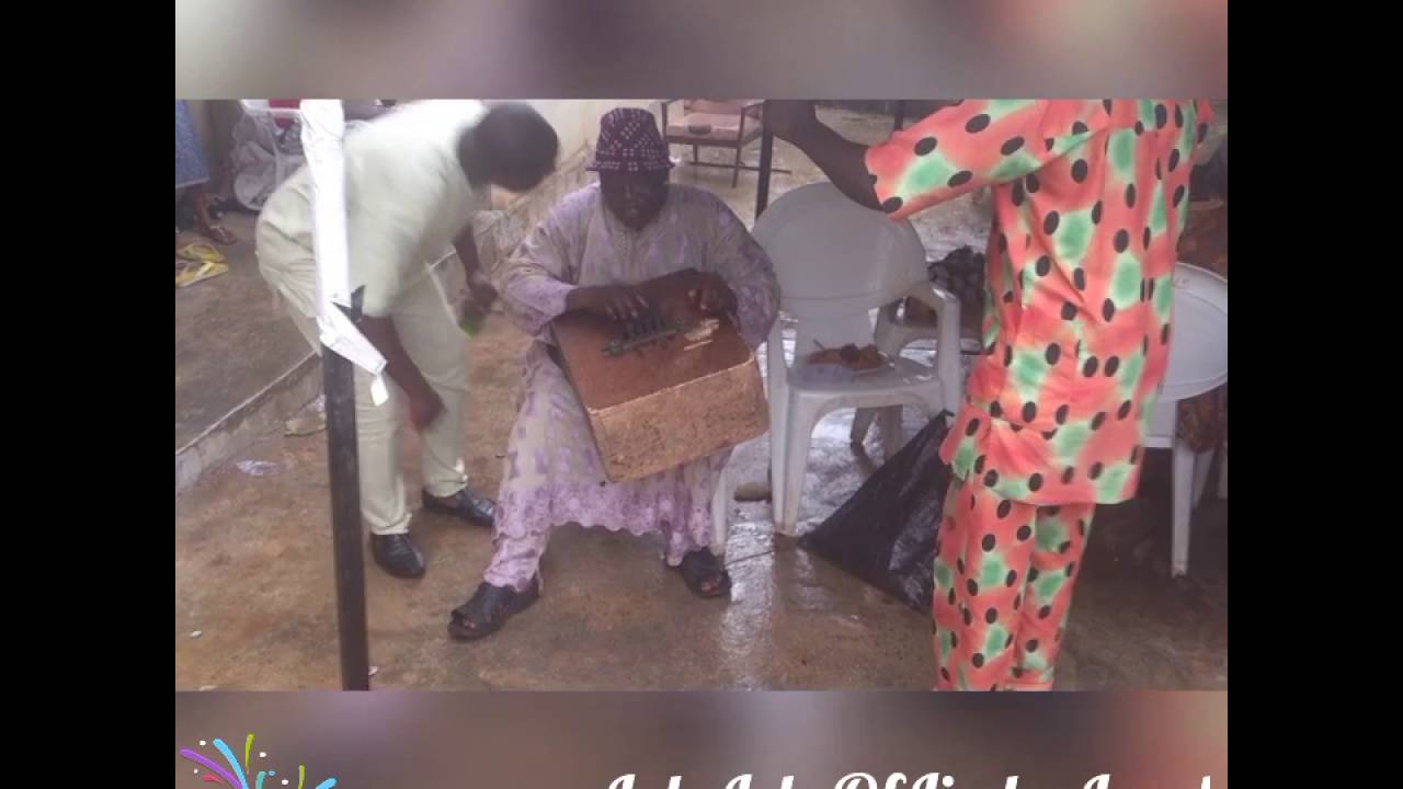 Lolo Lele Performing with  Agidigbo Instrument