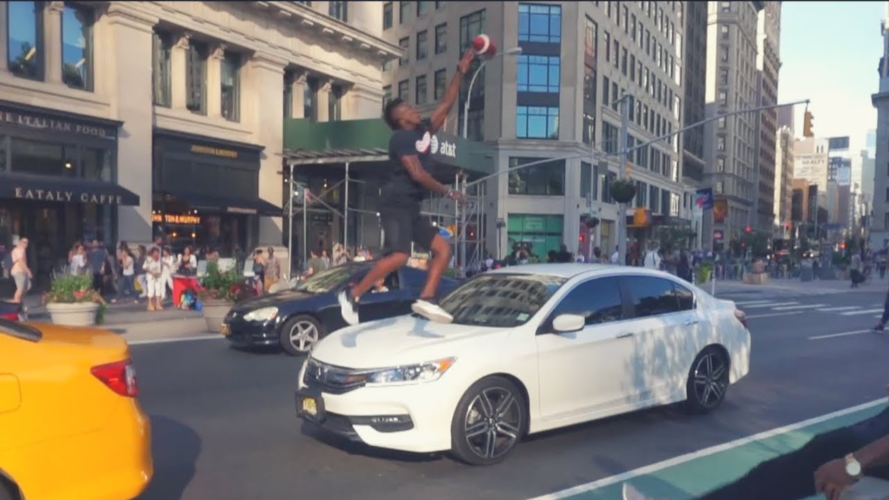 CATCHING FOOTBALLS OVER CARS